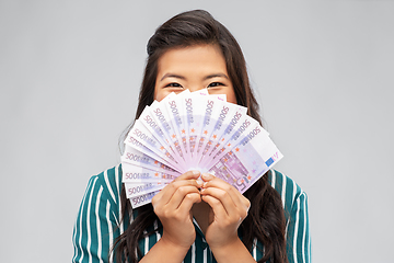 Image showing asian woman with hundred euro money banknotes