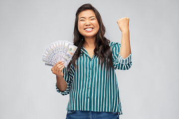 Image showing happy asian woman with money celebrating success