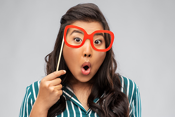 Image showing happy asian woman with big party glasses