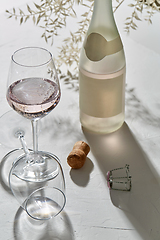 Image showing wine glasses and champagne bottle dropping shadows