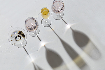 Image showing wine glasses dropping shadows on white surface