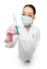 Image showing asian doctor in mask with medicine in syringe