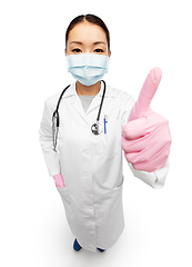 Image showing asian female doctor in mask showing thumbs up