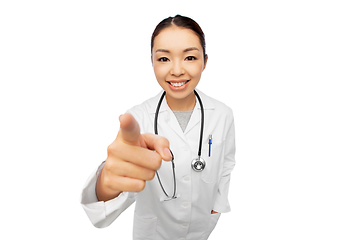 Image showing happy asian female doctor pointing to camera