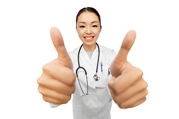 Image showing smiling asian female doctor showing thumbs up