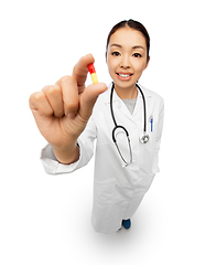 Image showing asian doctor with medicine and glass of water