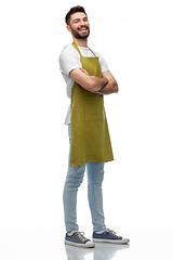 Image showing happy barman or waiter in apron with crossed arms