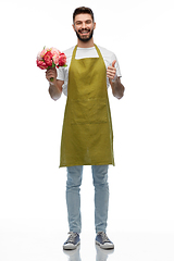 Image showing happy male gardener with flowers showing thumbs up