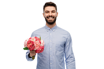 Image showing happy smiling man with bunch of flowers