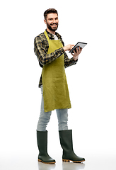 Image showing happy male gardener or farmer with tablet pc