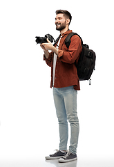 Image showing happy man or photographer with camera and backpack