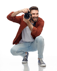 Image showing smiling man or photographer with digital camera