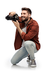 Image showing smiling man or photographer with digital camera