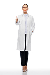 Image showing happy female doctor or scientist showing thumbs up