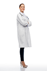 Image showing happy smiling female doctor in white coat