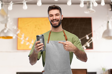 Image showing happy waiter with tumbler or takeaway thermo cup