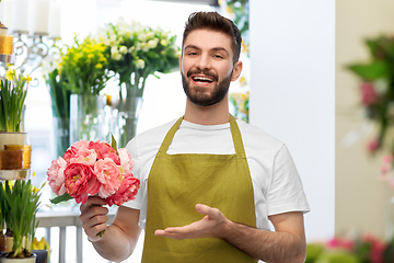 Image showing smiling male florist or seller at flower shop