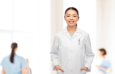 Image showing happy smiling asian female doctor at hospital