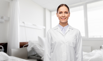 Image showing smiling female doctor in white coat at hospital