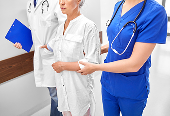 Image showing senior woman, doctor and nurse at hospital