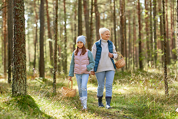 Image showing grandmother and granddaughter picking mushrooms