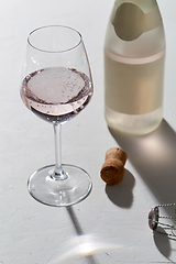 Image showing wine glasses and champagne bottle dropping shadows