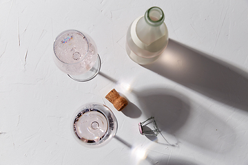 Image showing wine glasses and champagne bottle dropping shadows