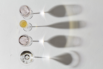 Image showing wine glasses dropping shadows on white surface