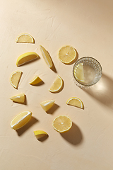 Image showing glass of water and lemon slices on table