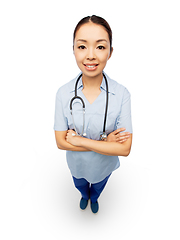 Image showing happy smiling asian female doctor or nurse