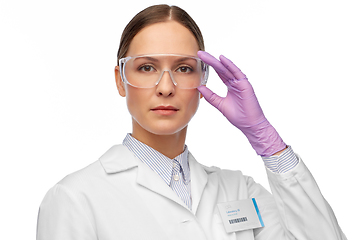 Image showing female scientist in goggles and gloves