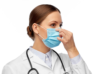 Image showing happy female doctor wearing medical mask