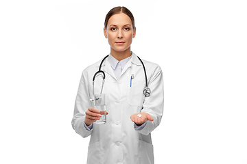 Image showing doctor with medicine and glass of water