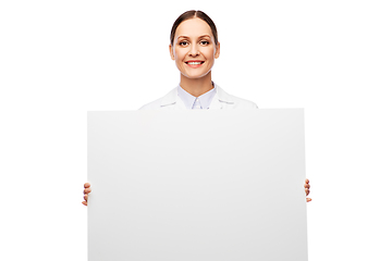 Image showing happy smiling female doctor holding white board