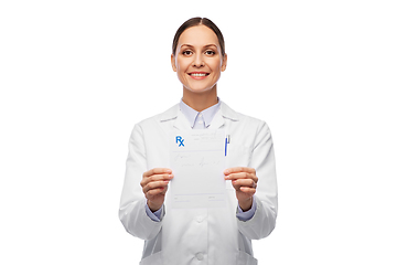 Image showing smiling female doctor with prescription blank