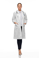 Image showing happy smiling female doctor in white coat
