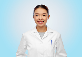 Image showing happy smiling asian female doctor in white coat