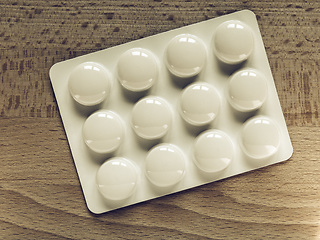 Image showing Vintage looking Medical pills on a table