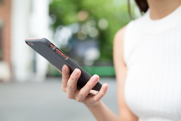 Image showing Woman holding a cellphone