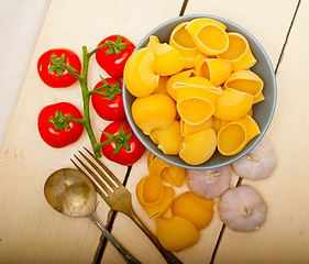 Image showing Italian snail lumaconi pasta with tomatoes