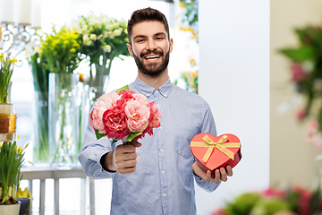 Image showing happy man with flowers and valentine's day gift