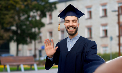 Image showing smiling male graduate student taking selfie