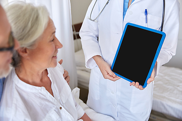 Image showing senior woman and doctor with tablet pc at hospital