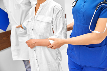 Image showing senior woman, doctor and nurse at hospital