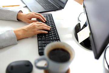 Image showing businesswoman with computer working at office