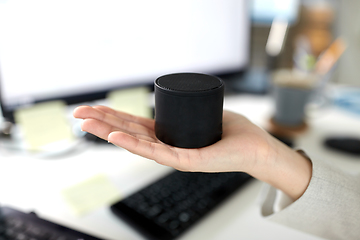 Image showing businesswoman using smart speaker at office