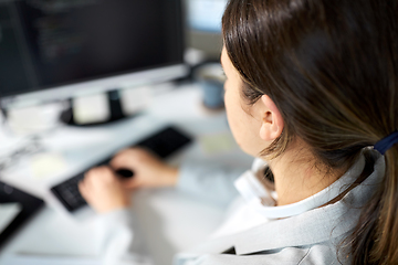 Image showing businesswoman with computer working at office