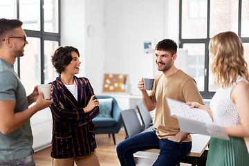 Image showing team of startuppers drinking coffee at office