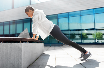 Image showing african american woman doing sports outdoors