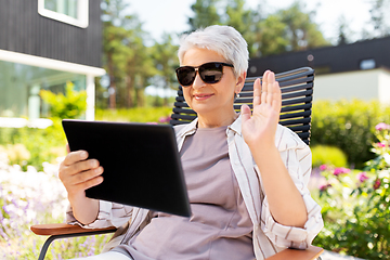 Image showing happy senior woman with tablet pc at summer garden